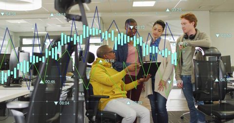 Diverse Team Analyzing Digital Financial Statistics in Modern Office