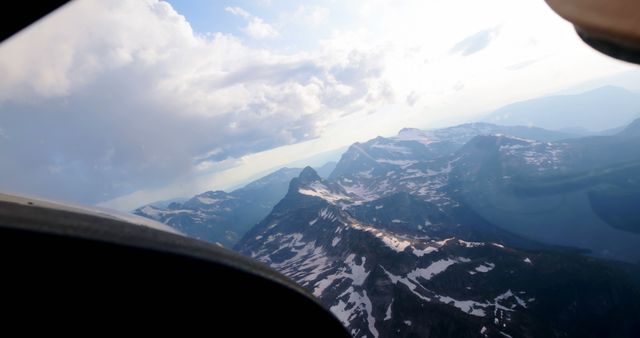 Private aircraft flying over snowcovered mountain 4k - Download Free Stock Photos Pikwizard.com