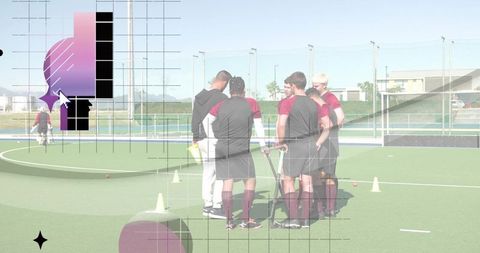 Maroon field hockey team huddling with coach on turf during outdoor training drill