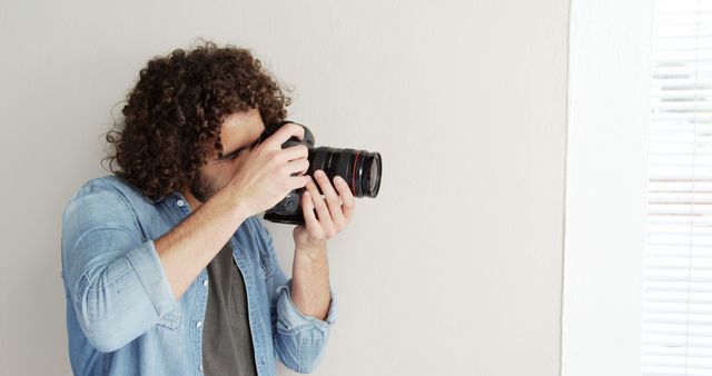 Creative Photographer Capturing Photo with DSLR - Download Free Stock Images Pikwizard.com