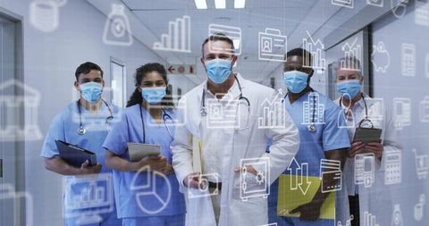 Clinical care team standing in hospital corridor with digital health analytics overlay