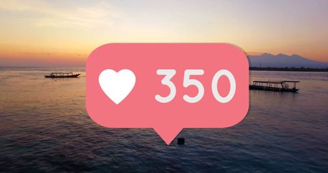 Social Media Likes Over Idyllic Ocean Sunset