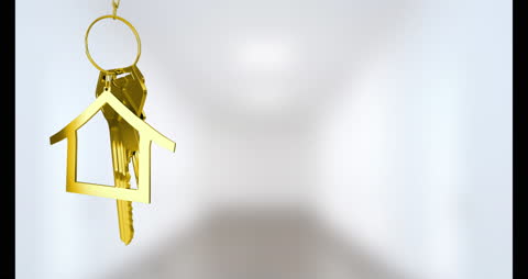 Golden House Key with Ring on Abstract Background