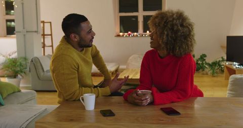 Diverse Couple Enjoying Conversation in Cozy Living Room