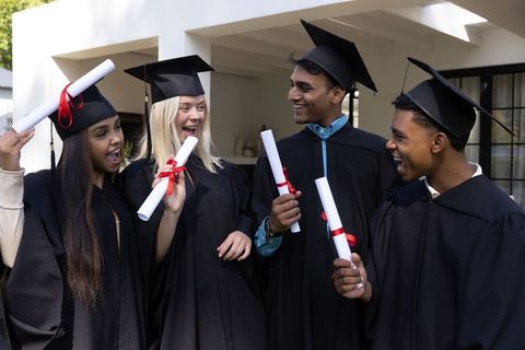 Diverse Graduates Celebrating Success Together Outside