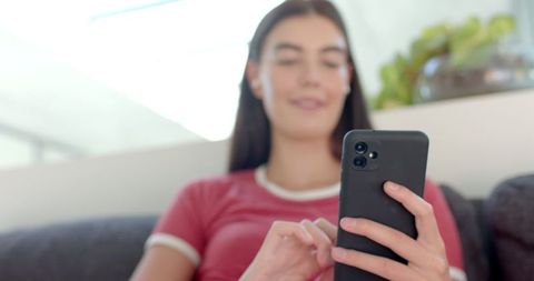 Teen Girl Using Smartphone at Home Relaxed Atmosphere