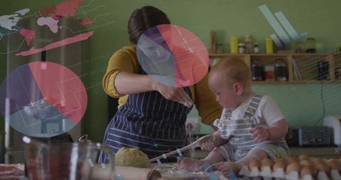 Mother Helping Baby Knead Dough in Kitchen Setting