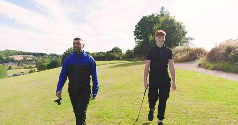 Father and Son Bonding on Sunlit Golf Course