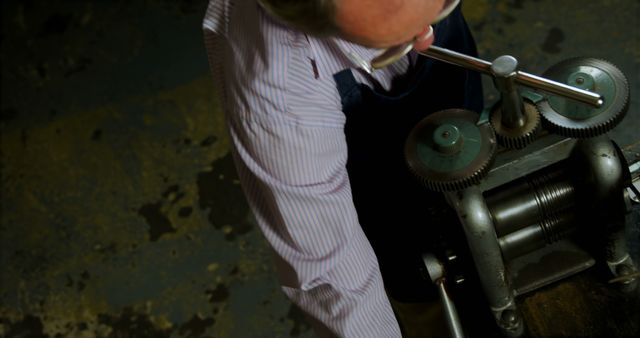 Man Working with Vintage Industrial Machinery - Download Free Stock Images Pikwizard.com