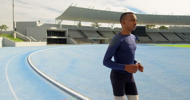 Athlete Jogging on Track at Modern Stadium - Download Free Stock Images Pikwizard.com