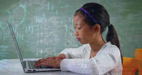 Young Girl Learning on Laptop with Data Overlays in Classroom - Download Free Stock Images Pikwizard.com