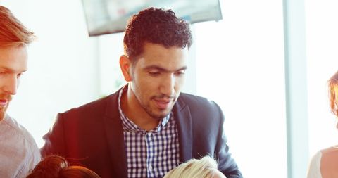 Diverse Team Engaged in Collaborative Business Discussion