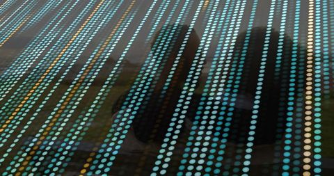 Geometric dot pattern with silhouetted figures at urban station