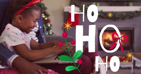 Festive African American Family Celebrating Christmas by Fireplace