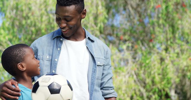 Father and Son Enjoying Time Together Outdoors With Soccer Ball - Download Free Stock Images Pikwizard.com