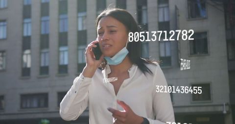 Worried Woman Conversing on Phone Amidst Coronavirus Metrics