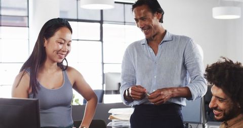 Diverse Team Collaborating and Communicating in Modern Office