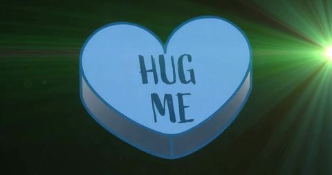 Floating blue heart candy with 'hug me' text and green flare