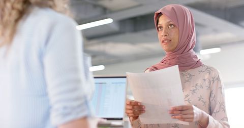 Diverse colleagues discussing new ideas in office