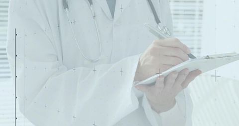 Medical Professional Writing on Clipboard in Clinical Setting