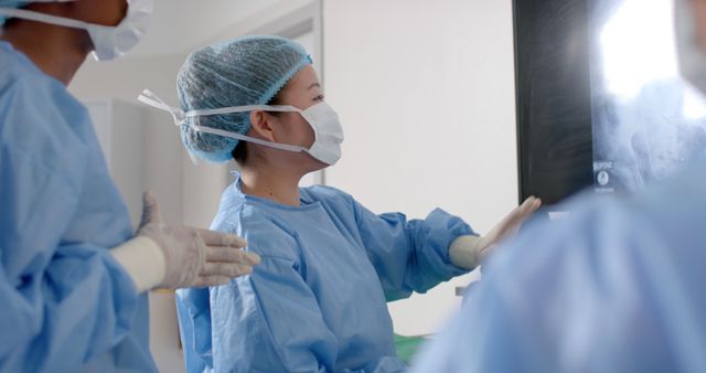 Medical Team Reviewing X-Ray in Hospital Room - Download Free Stock Images Pikwizard.com