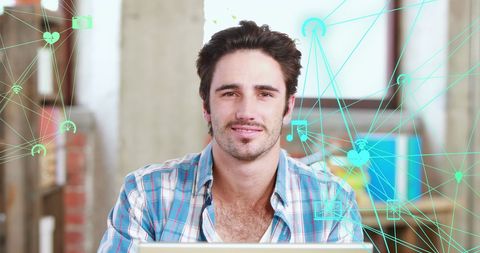 Man Using Laptop with Digital Icons and Connections