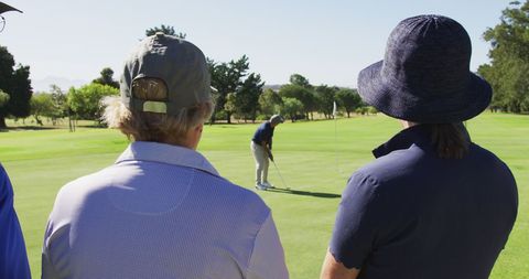 Senior Man Practicing Golf with Friends Watching - Download Free Stock Images Pikwizard.com