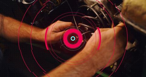Mechanic hands working in engine bay with futuristic hud overlay