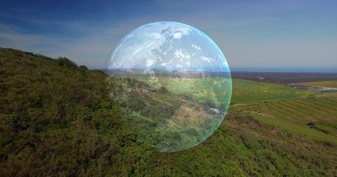 Conceptual Earth Overlay in Mountain Landscape Celebrating Earth Day