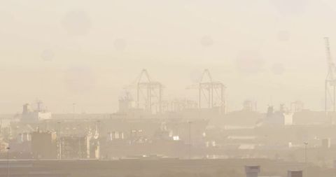 Coastal Gantry Cranes in Foggy Harbor Silhouette
