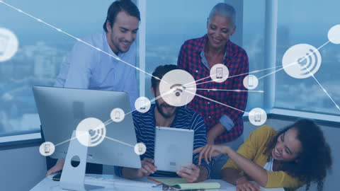 Diverse Team Collaborating on Digital Network Ideas in Modern Office