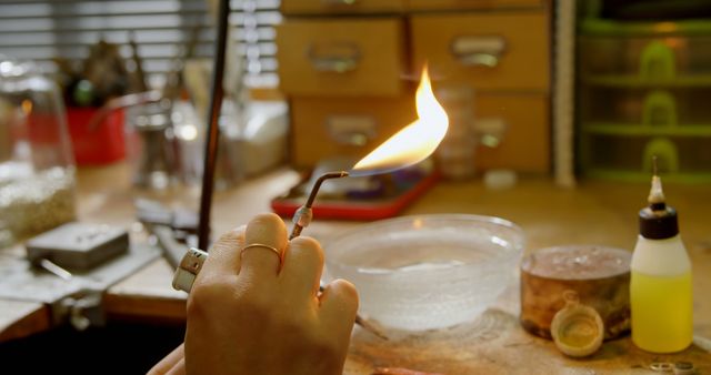 Jeweler Using Torch at Workbench Creating Jewelry - Download Free Stock Images Pikwizard.com