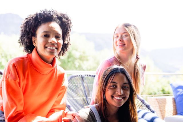 Happy Diverse Teenage Friends Relaxing on Balcony - Download Free Stock Images Pikwizard.com