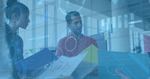 Diverse Team Analyzing Data Visualizations in Modern Office Environment