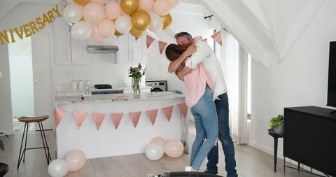 Joyful anniversary celebration and surprise at home