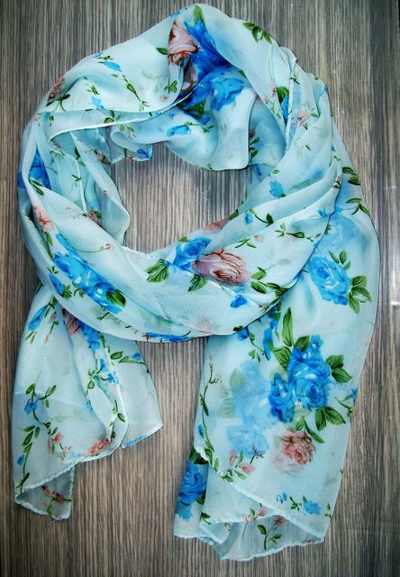 Elegant Floral Scarf with Blue and Pink Flowers on Wooden Surface - Download Free Stock Photos Pikwizard.com