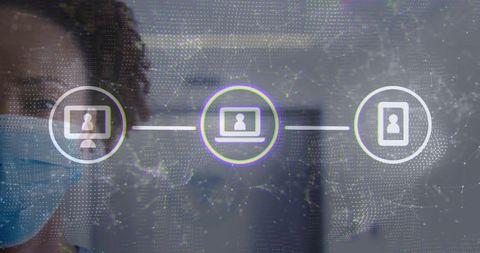 Masked professional in office connecting devices with digital network overlay