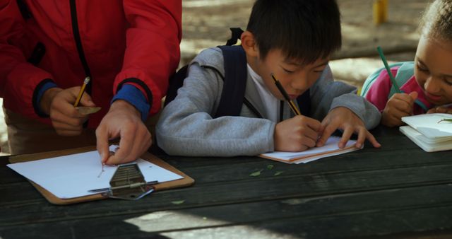 Children Studying Nature Outdoors at Table - Download Free Stock Images Pikwizard.com