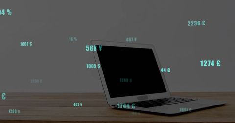 Displaying Silver Laptop Partly Open on Wooden Desk with Teal Currency Data Overlay