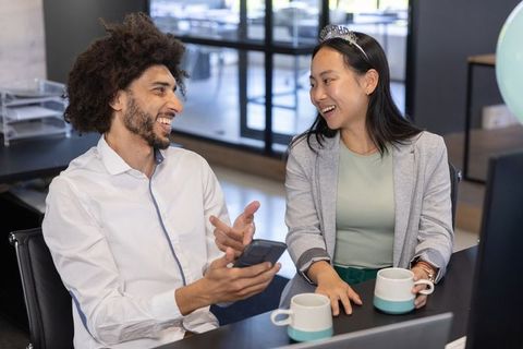 Diverse Coworkers Celebrating in Modern Office Space