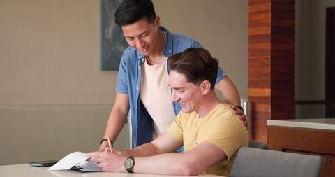 Happy Diverse Male Couple Enjoying Quality Time Together at Home