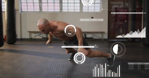 Shirtless athlete performing plyometric push-up with fitness hud data overlay in gym