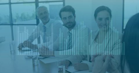 Diverse Corporate Team Analyzing Financial Data in Office Setting