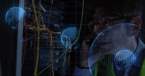 Tech professional analyzing server cables with digital globes overlay