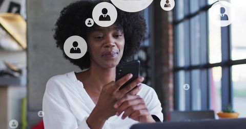 Businesswoman engaged in digital communication on smartphone