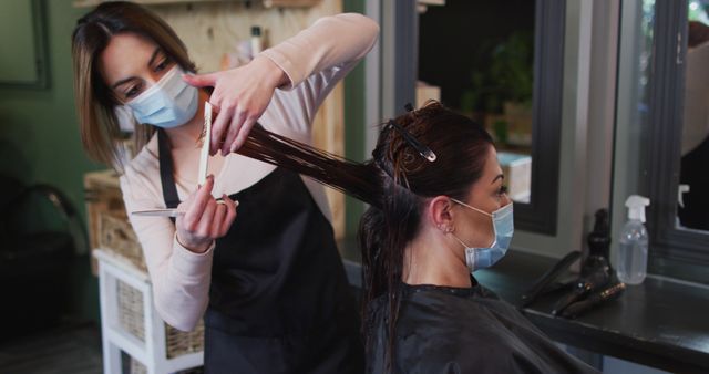 Hairdresser Wearing Mask Cutting Woman's Hair in Salon - Download Free Stock Images Pikwizard.com