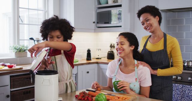 Happy African American Family Preparing Meal Together in Modern Kitchen - Download Free Stock Images Pikwizard.com