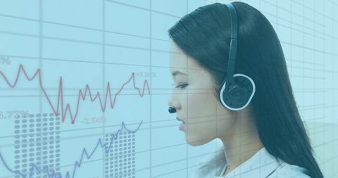 Asian Female Consultant Analyzing Financial Data