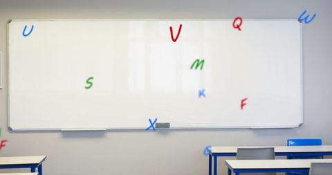 Floating alphabet in modern classroom with whiteboard