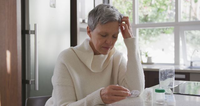 Elderly Woman Checking Medication at Home Kitchen - Download Free Stock Images Pikwizard.com